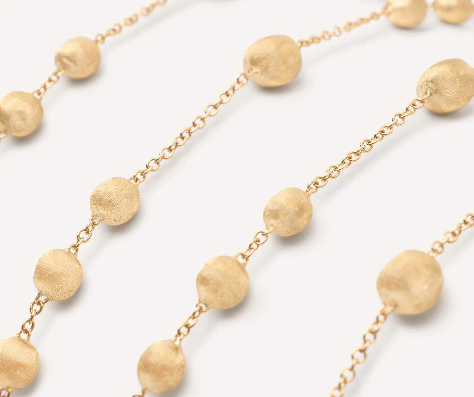 Collana lunga a catena con sfere in oro giallo,Africa, Marco Bicego