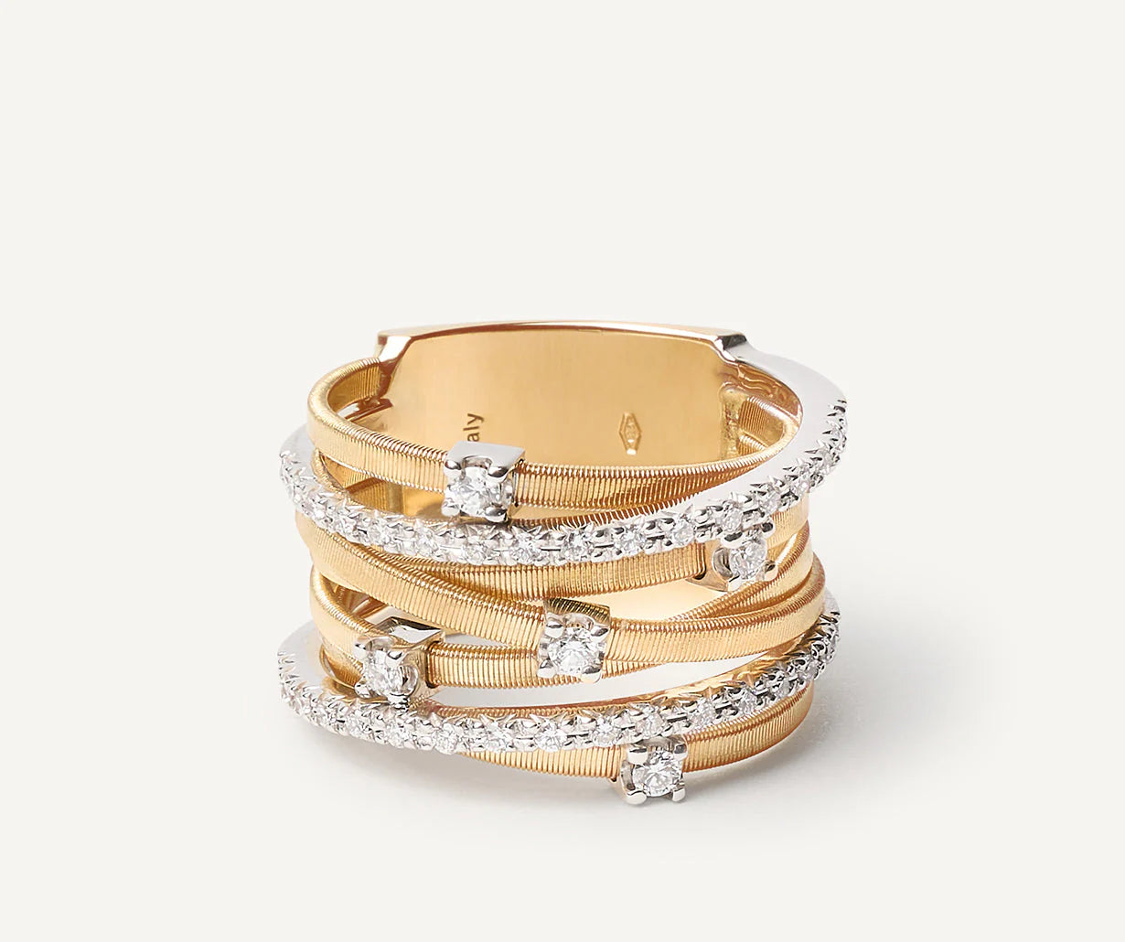 Anello a sette fili con castoni e barrette di diamanti in oro giallo, Goa, Marco Bicego