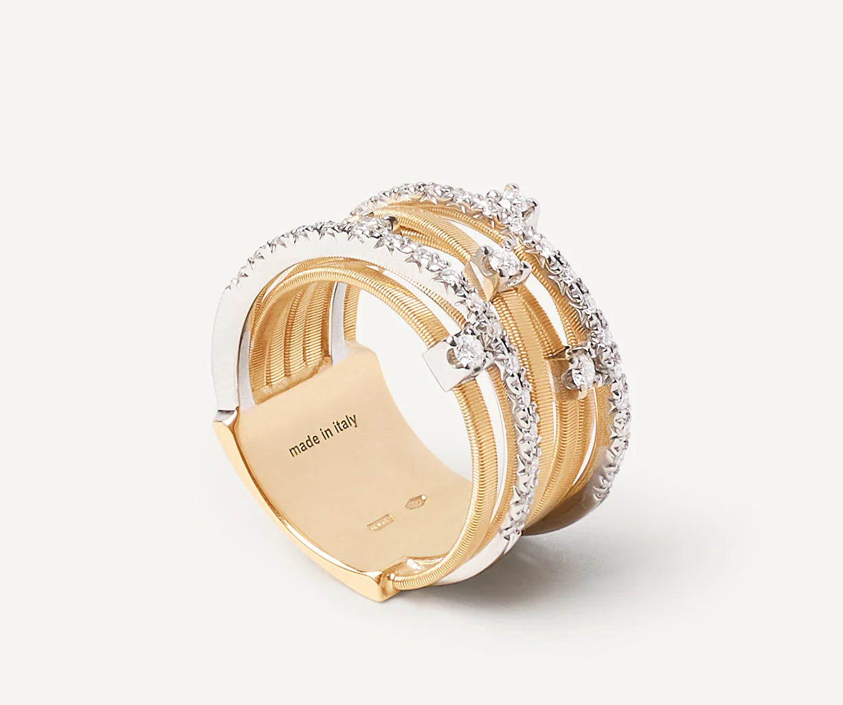 Anello a sette fili con castoni e barrette di diamanti in oro giallo, Goa, Marco Bicego